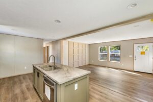 Open-concept interior of a double wide manufactured home sold by Northern Mobile Homes, a mobile home dealer in Belmont NH