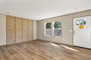 Open living area inside a double wide manufactured home sold by Northern Mobile Homes, a manufactured home dealer in Rochester NH