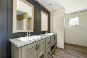 Primary bathroom with double vanity inside a manufactured home sold by Northern Mobile Homes, a manufactured home dealer in Rochester NH
