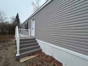 Side entry of a manufactured home sold by Northern Mobile Homes, a manufactured home retailer in Exeter NH