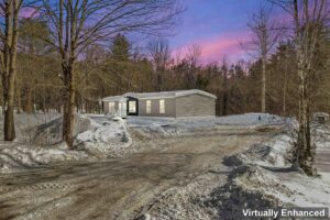 Manufactured home exterior in winter sold by Northern Mobile Homes, a manufactured home retailer serving New Hampshire
