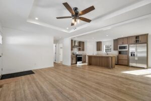 Open-concept living and kitchen interior inside a manufactured home sold by Northern Mobile Homes, a mobile home dealer in Ashland NH