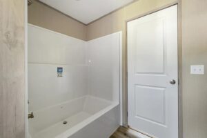 Bathroom tub and shower inside a manufactured home sold by Northern Mobile Homes, a mobile home dealer in Rochester NH