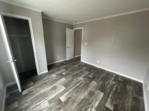 Bedroom interior inside a mobile home sold by Northern Mobile Homes, a mobile home retailer in Rochester NH