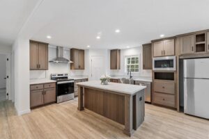 Modern kitchen with island inside a manufactured home sold by Northern Mobile Homes, a manufactured home dealer serving Massachusetts