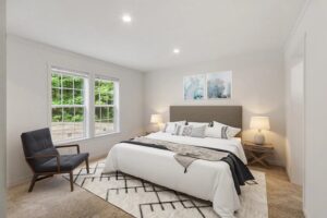 Staged primary bedroom inside a manufactured home sold by Northern Mobile Homes, a manufactured home dealer in Lyndeborough NH