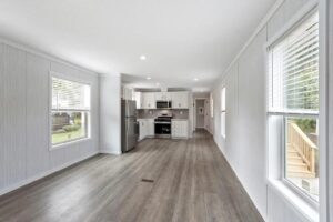 Open-concept living area and kitchen inside a manufactured home sold by Northern Mobile Homes in Seabrook NH