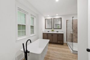 Primary bathroom with soaking tub and walk-in shower inside a manufactured home sold by Northern Mobile Homes, a manufactured home dealer in Lyndeborough New Hampshire