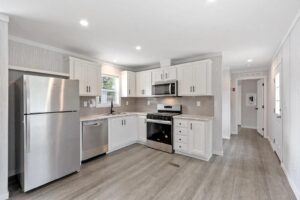 Full kitchen interior of a manufactured home sold by Northern Mobile Homes, a mobile home dealer in Seabrook NH